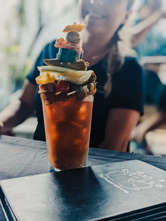 A towering bloody mary drink.